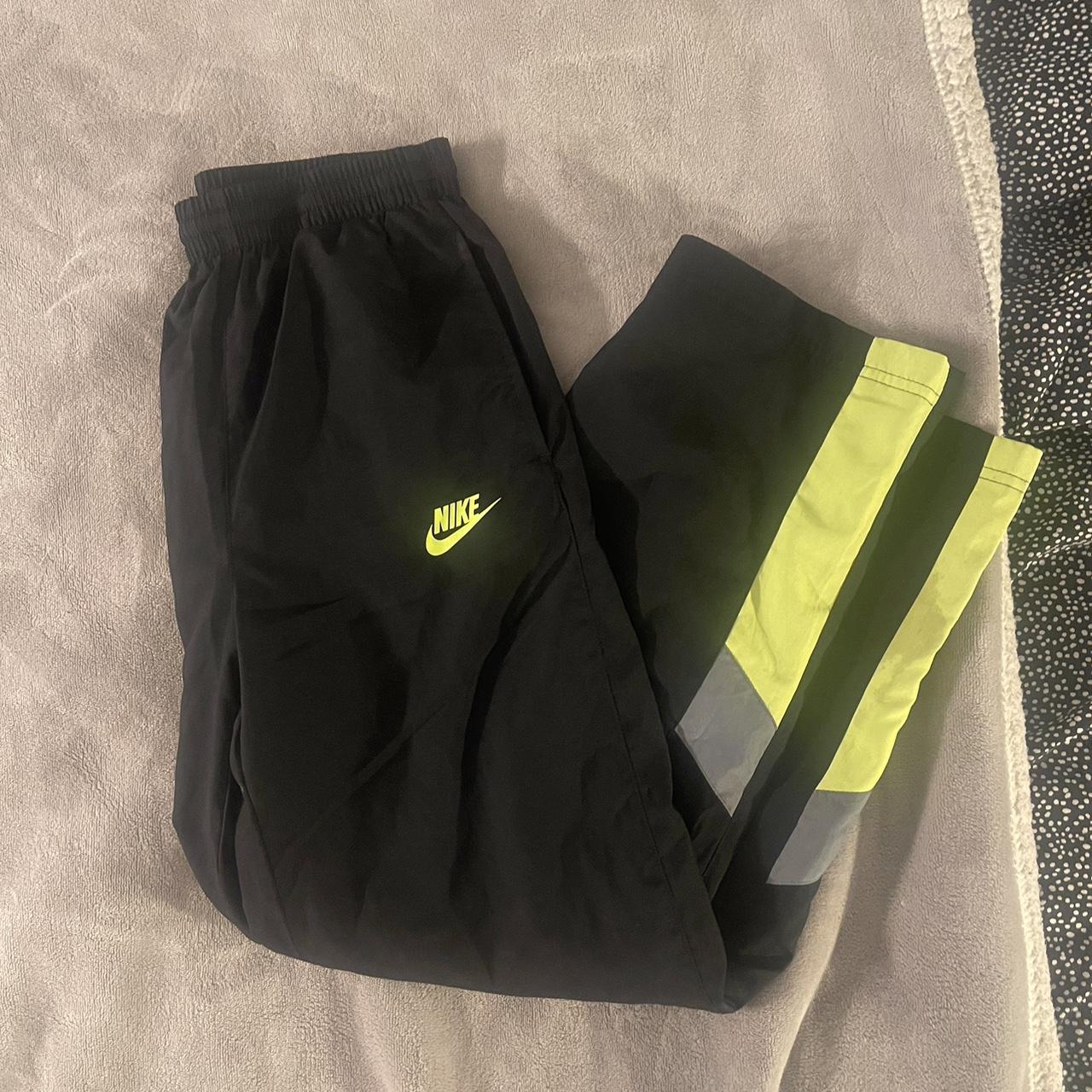 Black and store yellow nike sweatpants