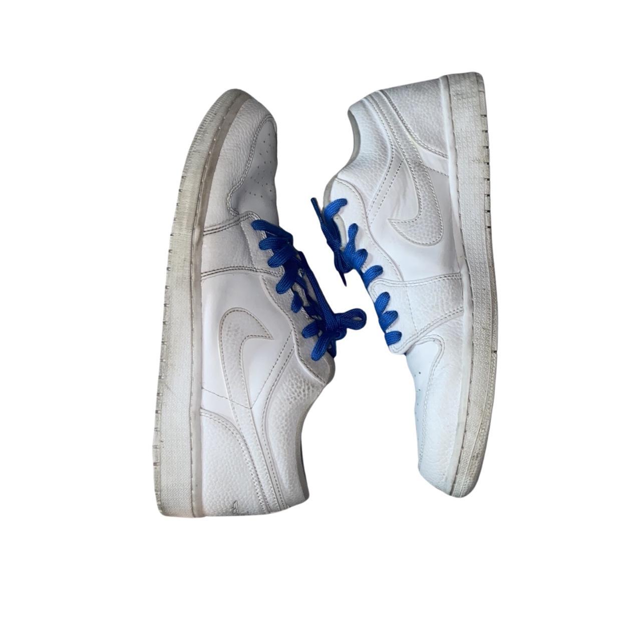 blue and white jordans with orange laces