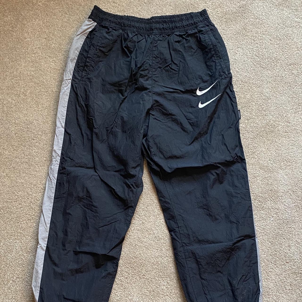 Vintage black Nike tracksuit pants Size... Depop