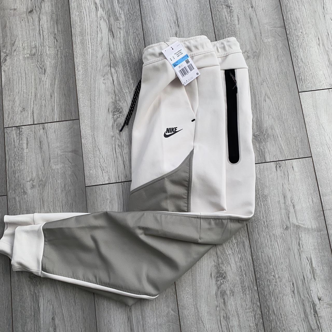 nike tech cream joggers