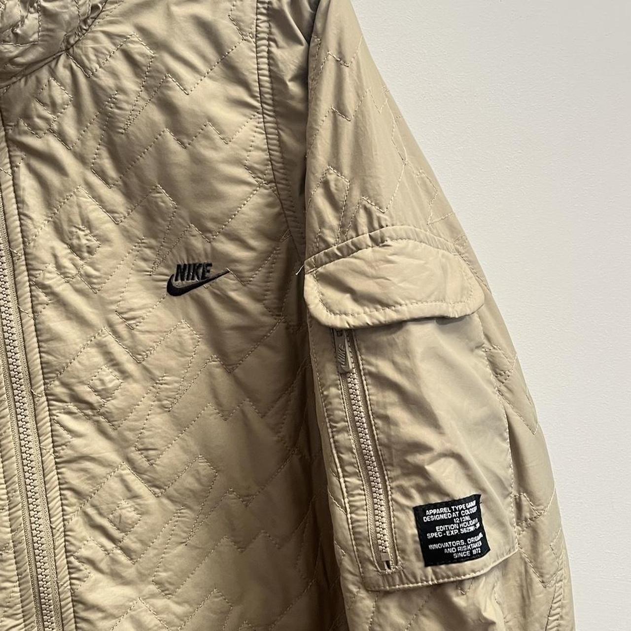 beige nike jacket