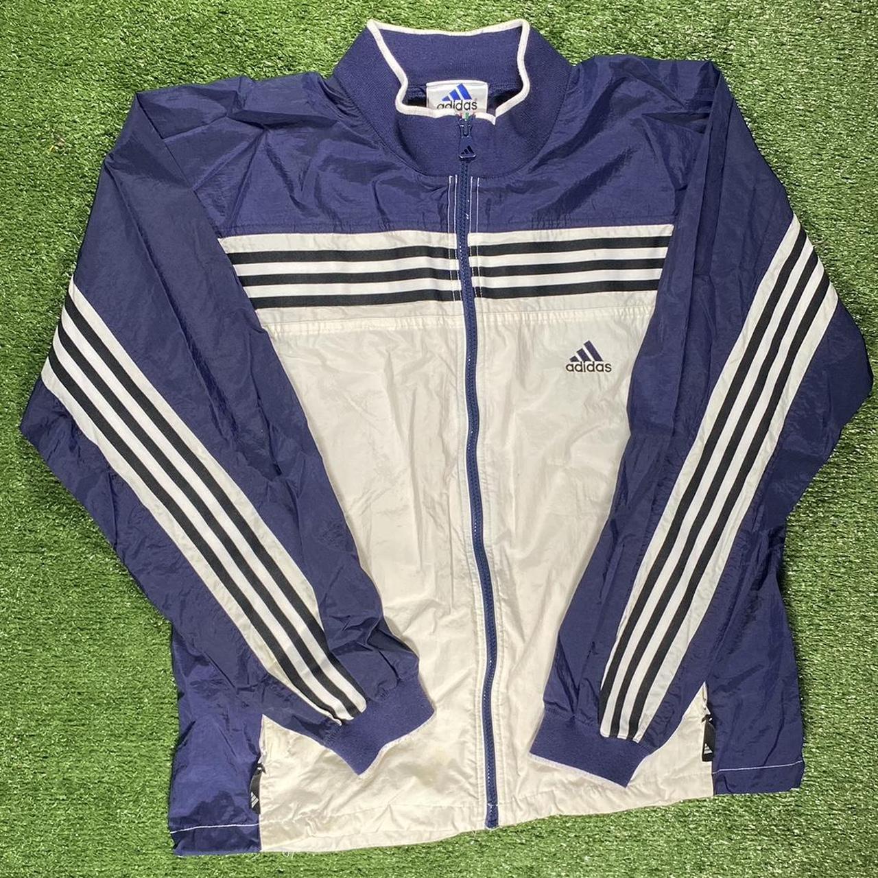 Navy blue and white best sale adidas jacket