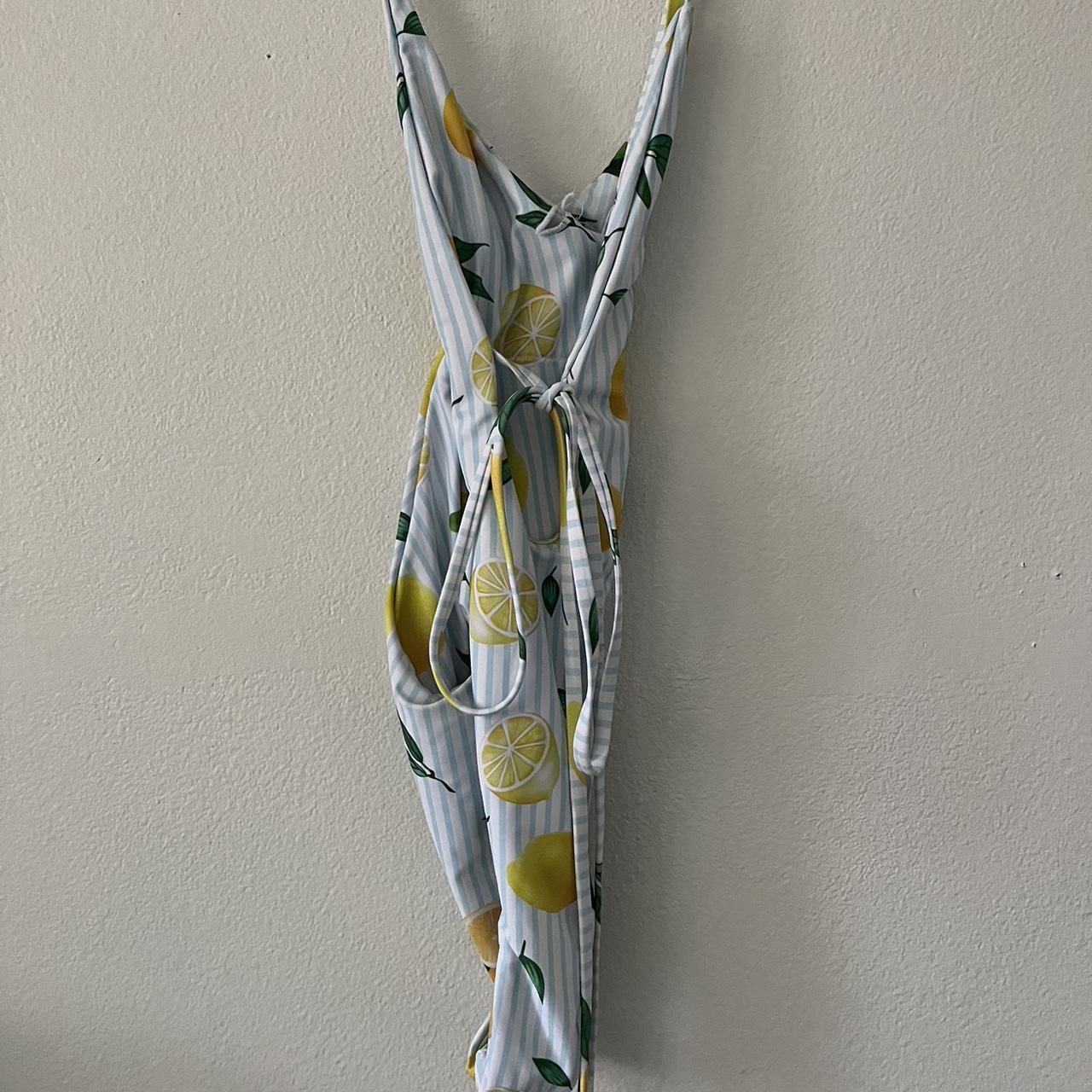 Lemon Bathing Suit one piece deep v ties around... Depop