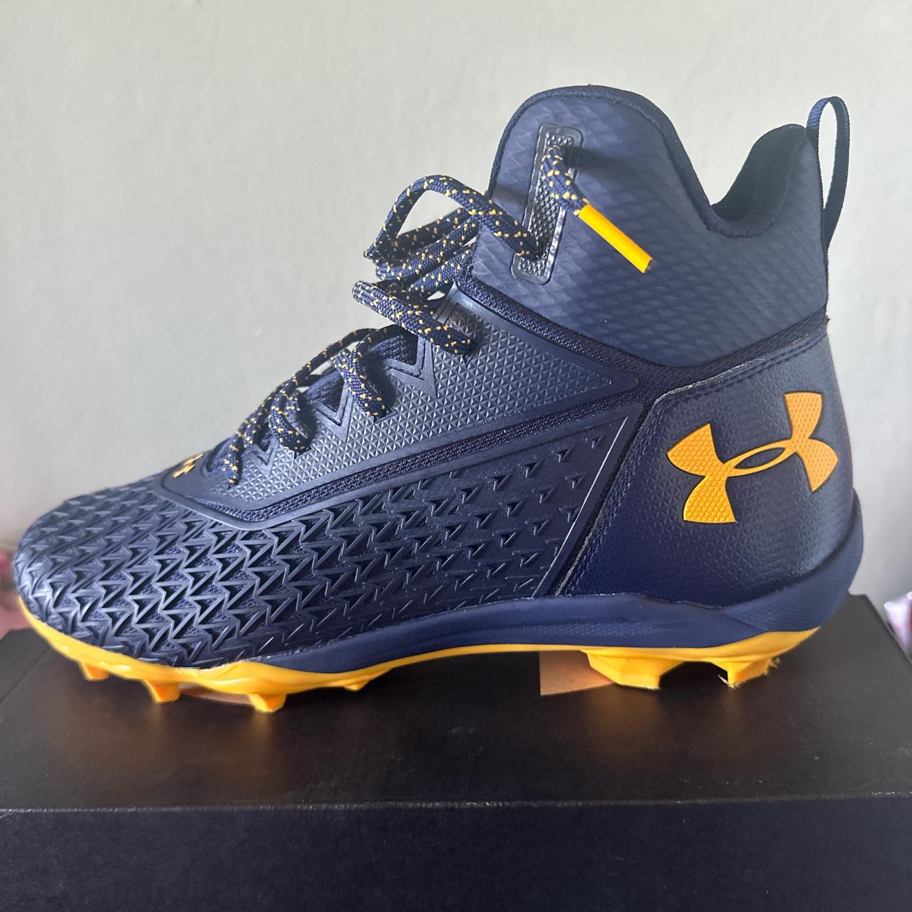 navy blue and yellow football cleats