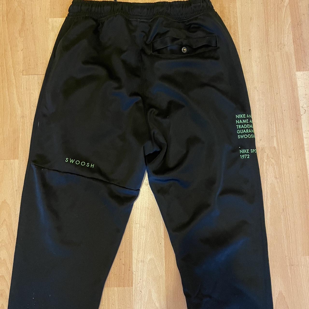 red nike swoosh joggers