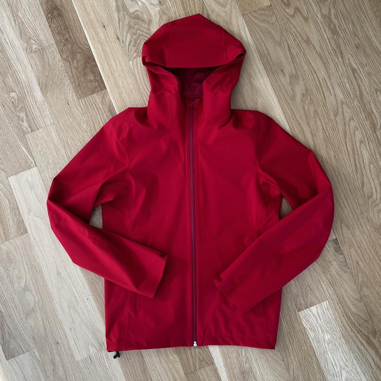 Uniqlo rain jacket in a vibrant red worn once size