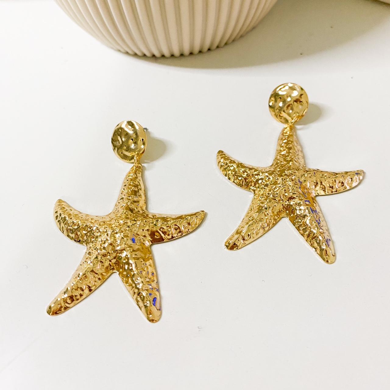 Gold textured starfish drop earrings. Lightweight to... - Depop