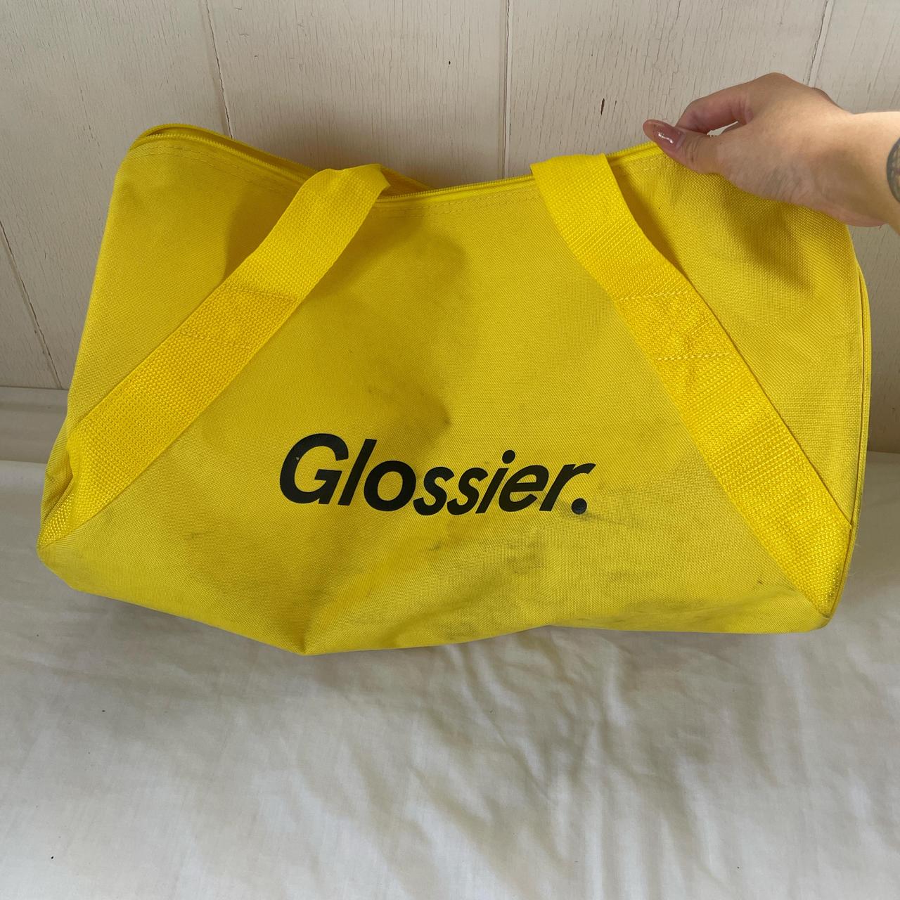 glossier sunshine yellow duffle bag. this bag is