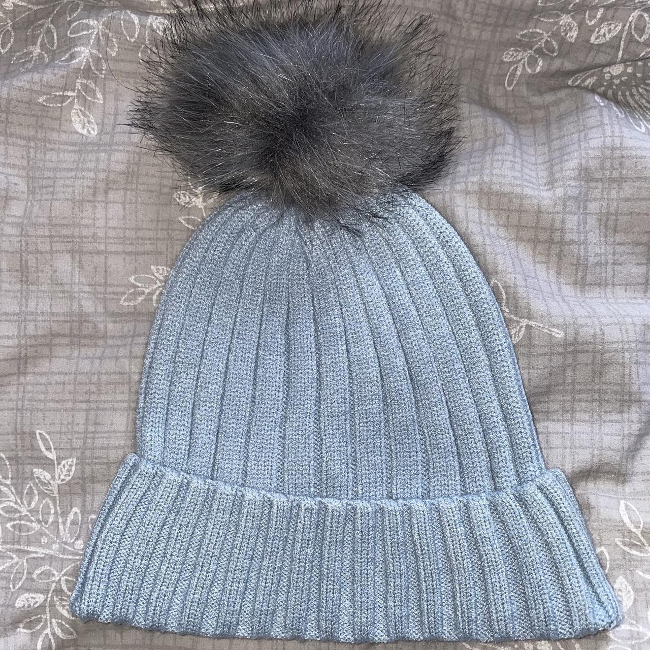 Primark baby blue knitted hat with grey bobble.... - Depop