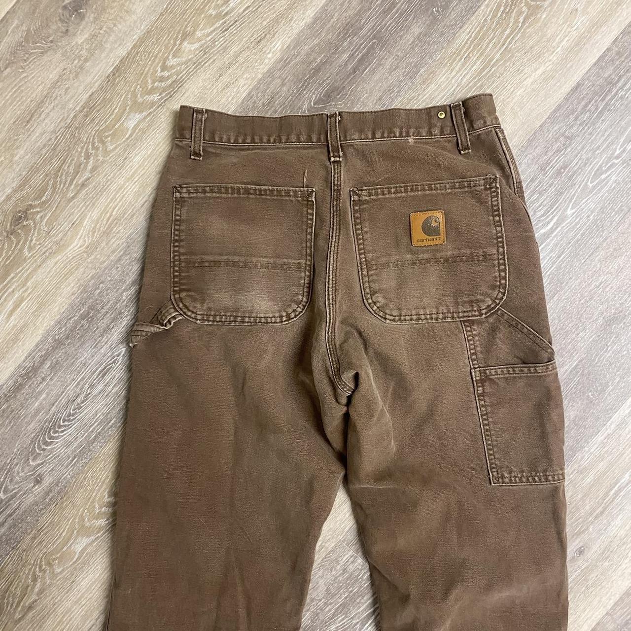 Brown carhartt pants, worn to perfection/ ripped... - Depop