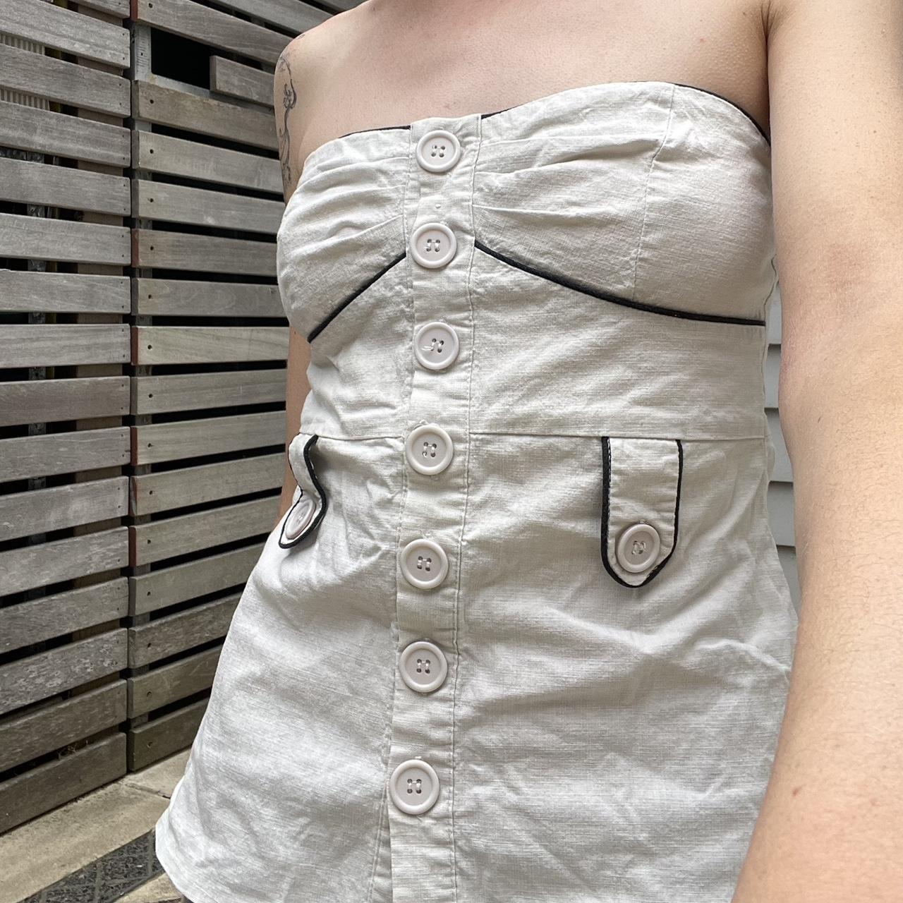 Cream strapless top with decorative buttons and... - Depop