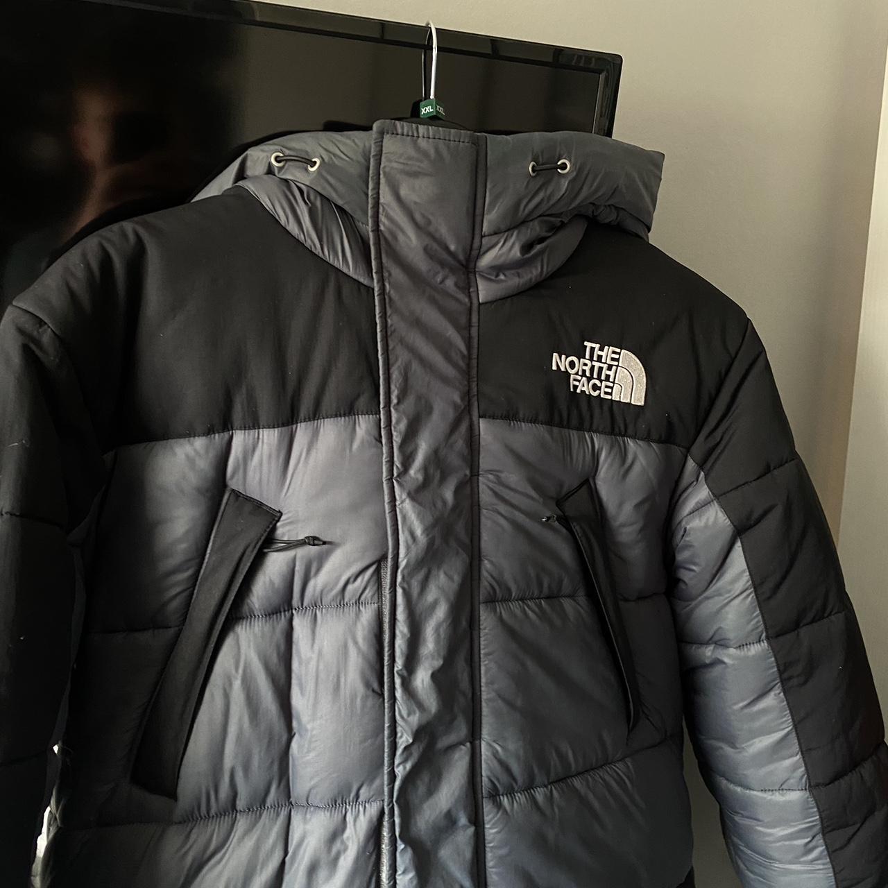 Black and grey north face coat, damaged right sleeve - Depop