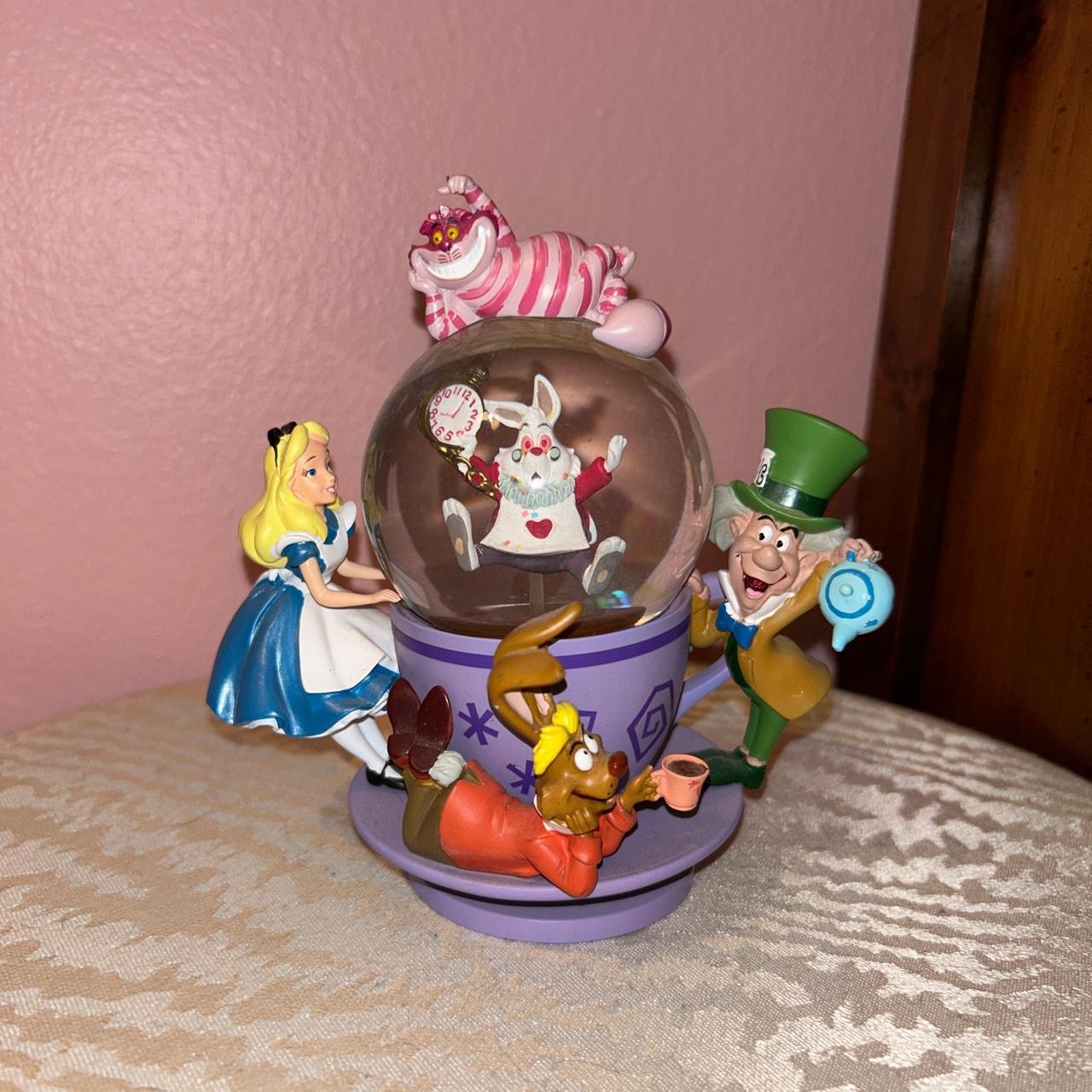 Alice in Wonderland spinning snow globe. Authentic... - Depop