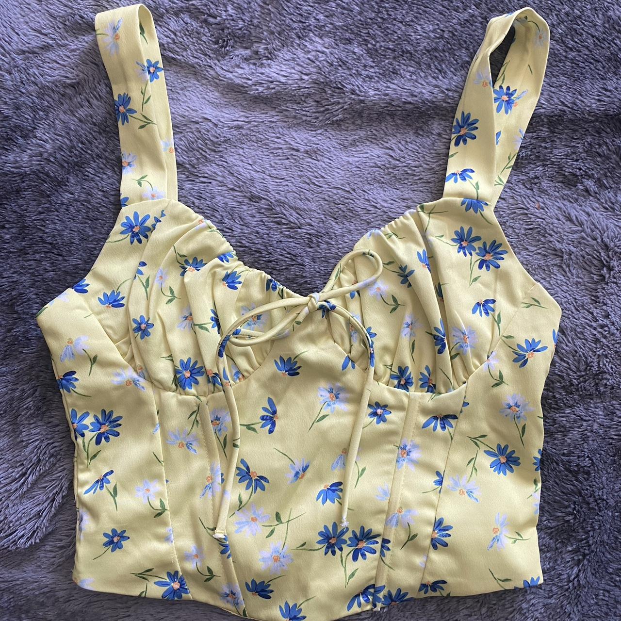 yellow corset from bershka with blue flower print... Depop