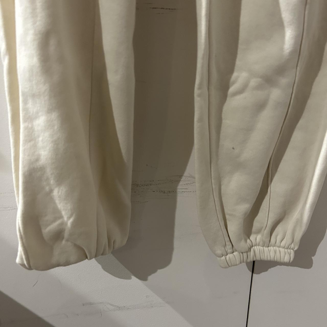 nike tech cream joggers