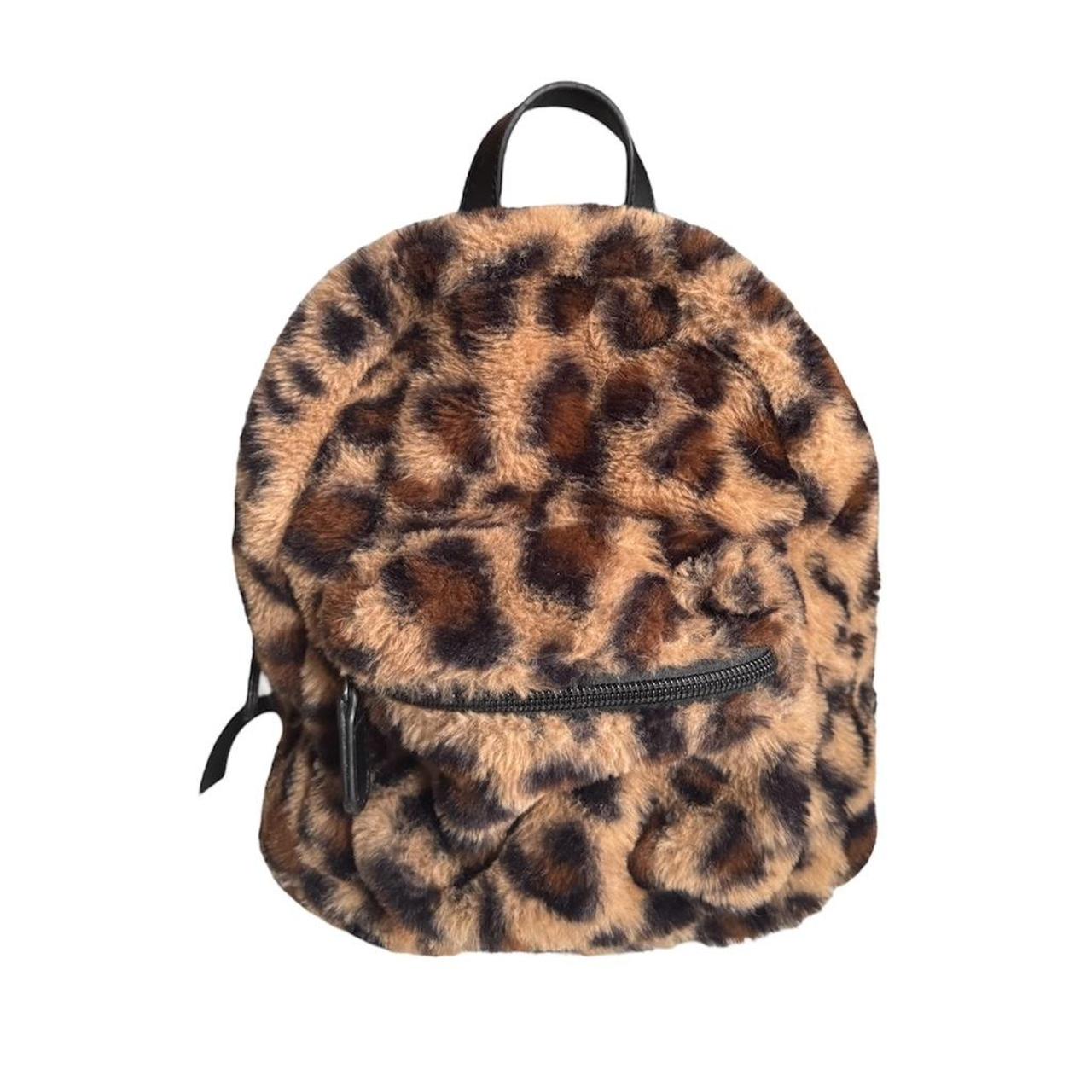 Cheetah print backpack has two pockets zip closure. Depop