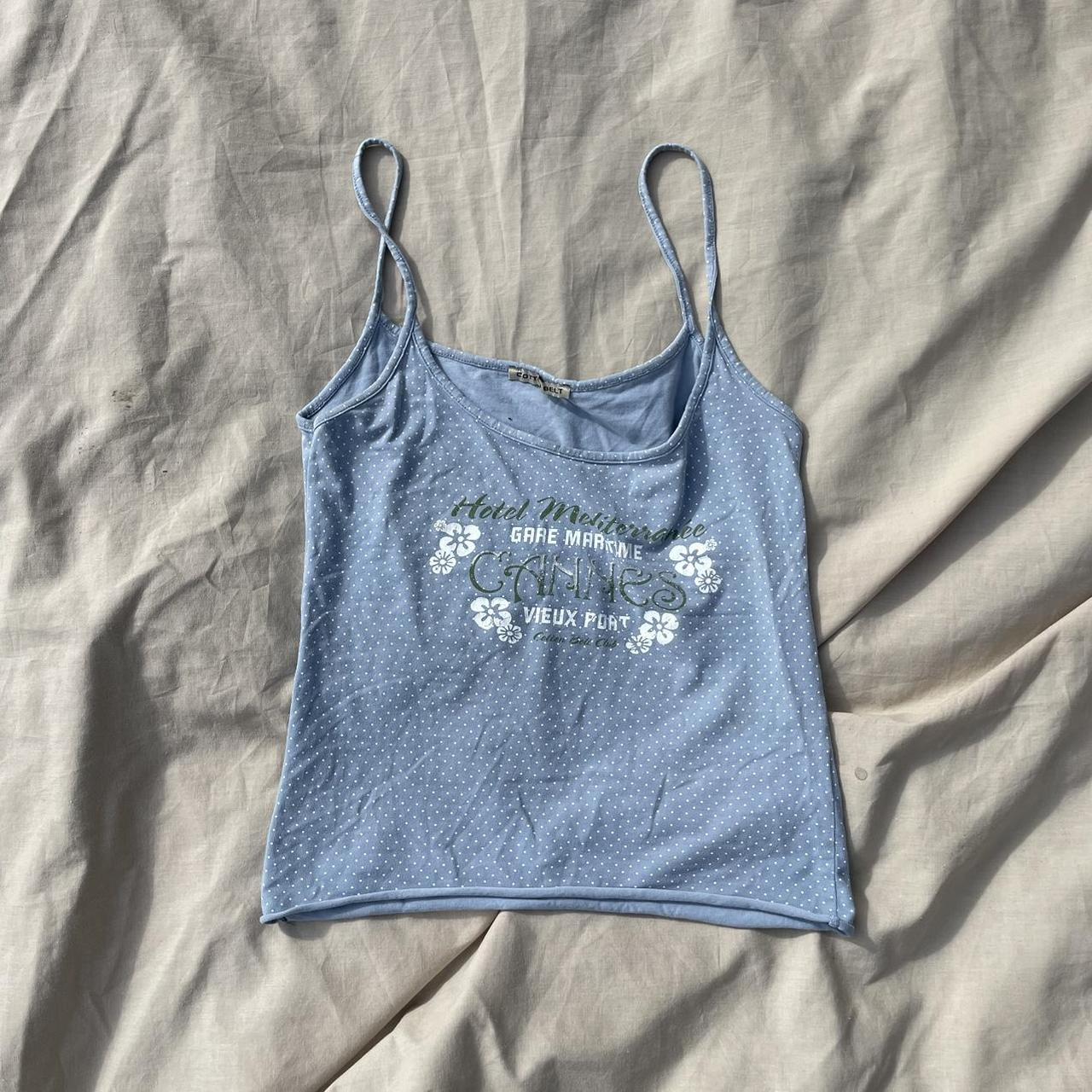 Iconic y2k baby blue tank top with white polka dot... Depop