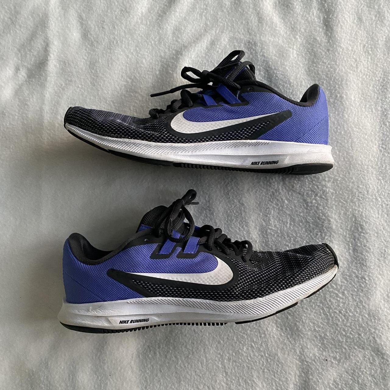 purple white and black nike shoes