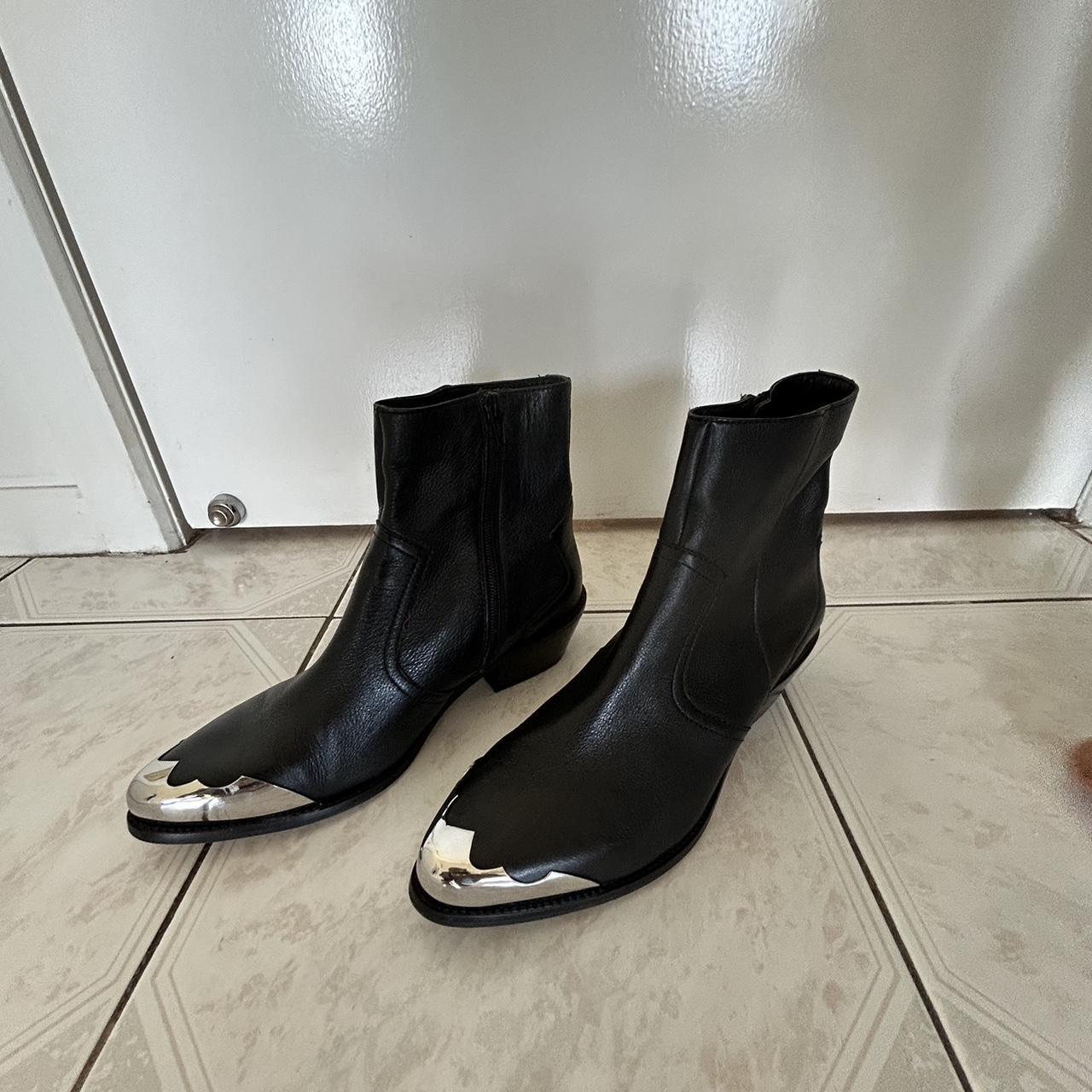 Western style zip up boot with metal accents. Worn a... - Depop