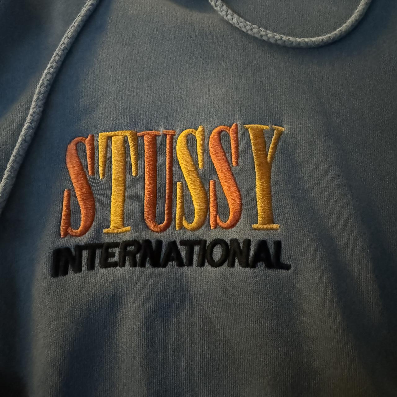 Stussy international hoodie Slight rip but can be... - Depop