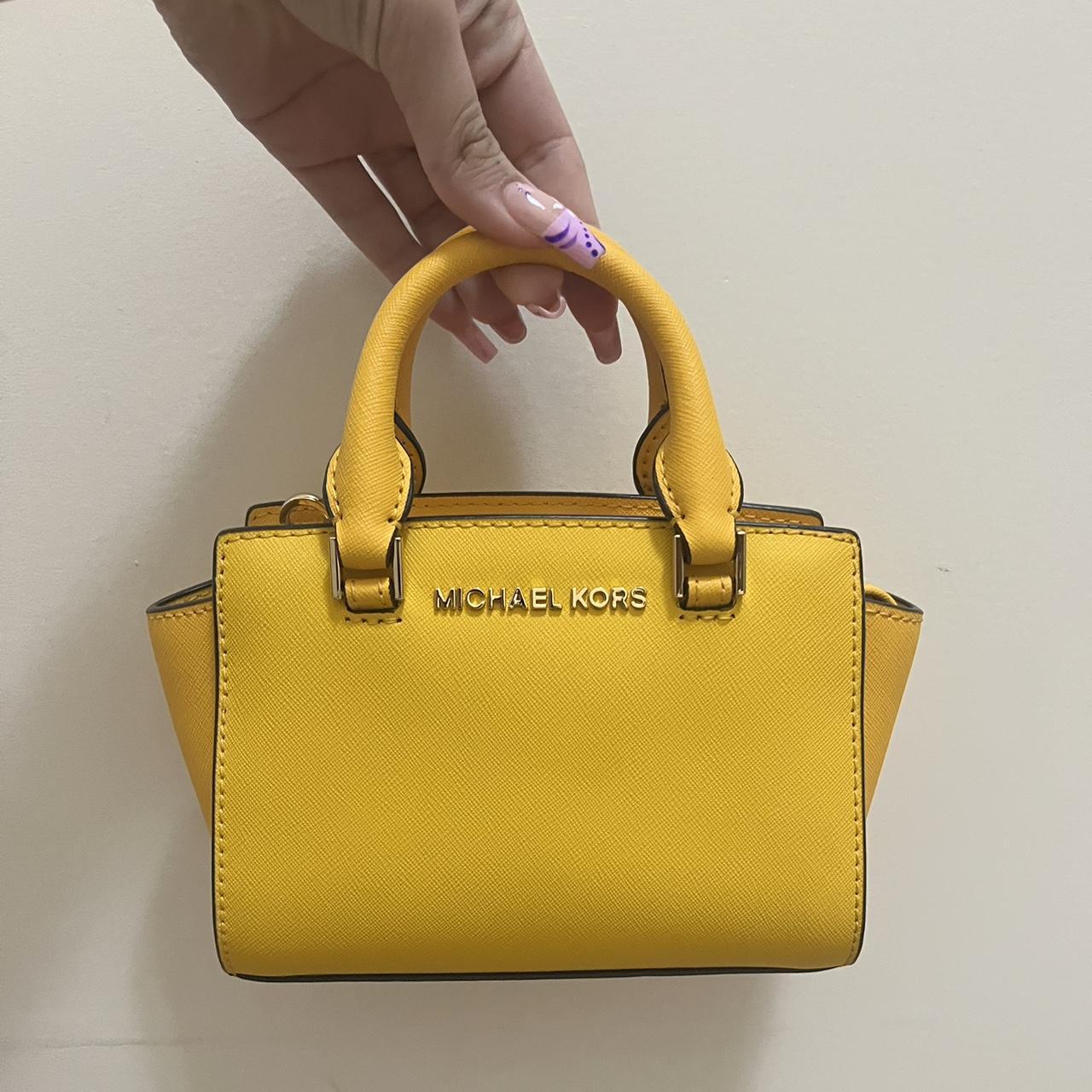 Cute Michael Kors small yellow handbag. Never. Depop