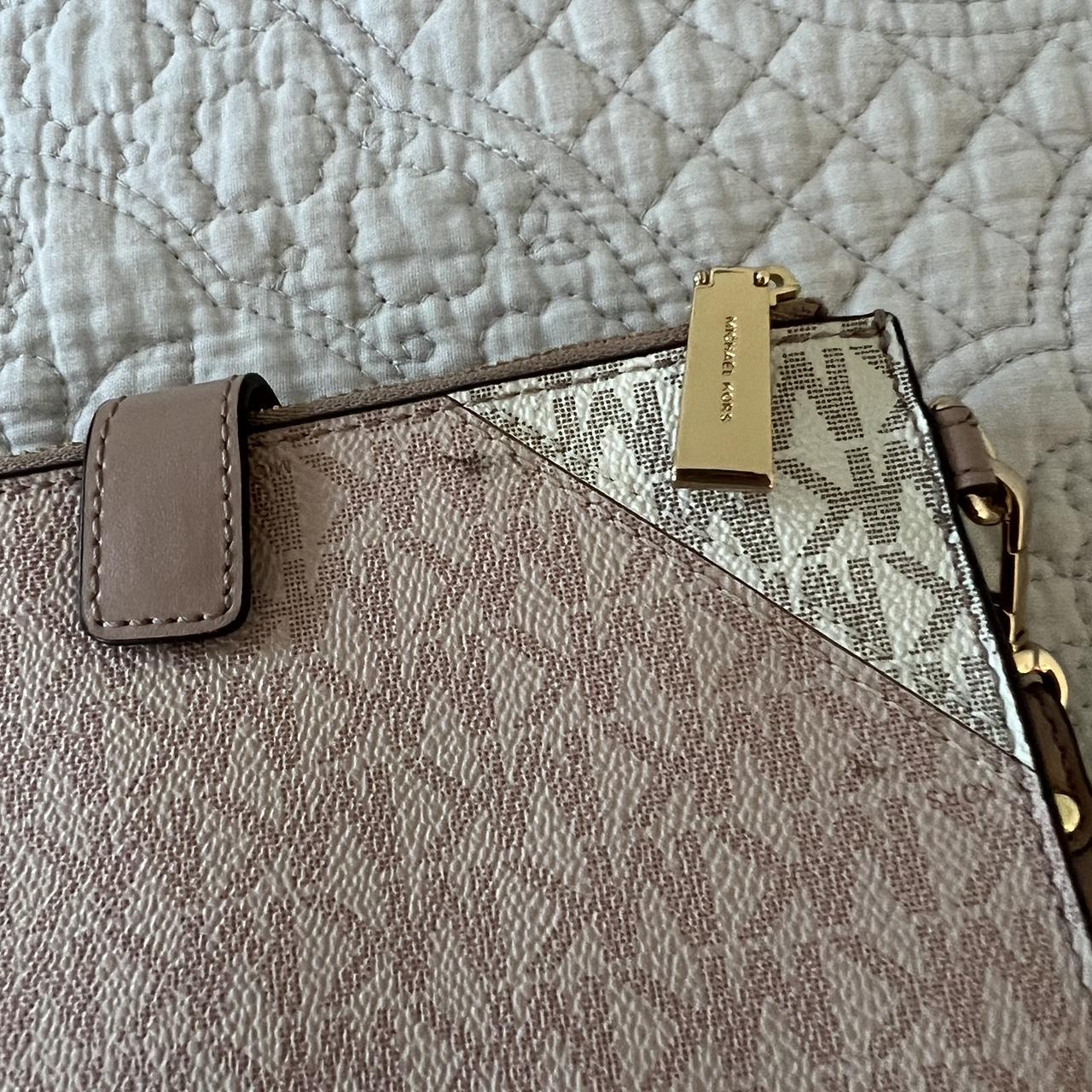 Pink Michael Kors Wallet / Wristlet This wallet is... - Depop