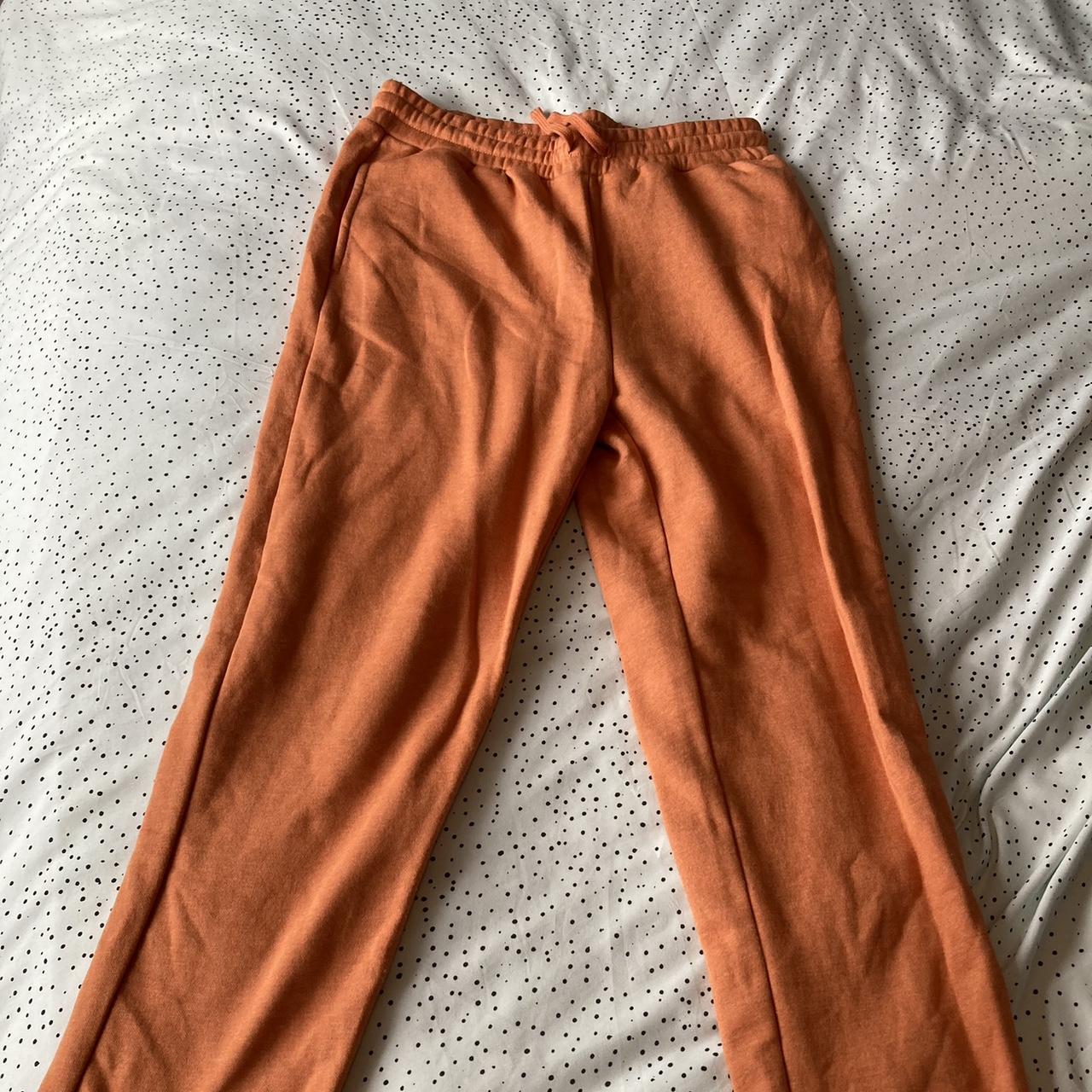 Primark orange tracksuit bottoms/sweatpants, size... Depop