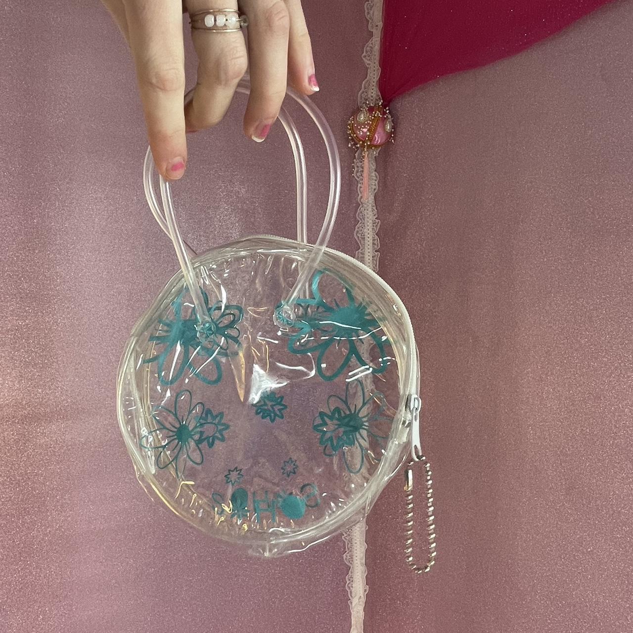 Clear, mini purse with y2k pattern on the outside Depop