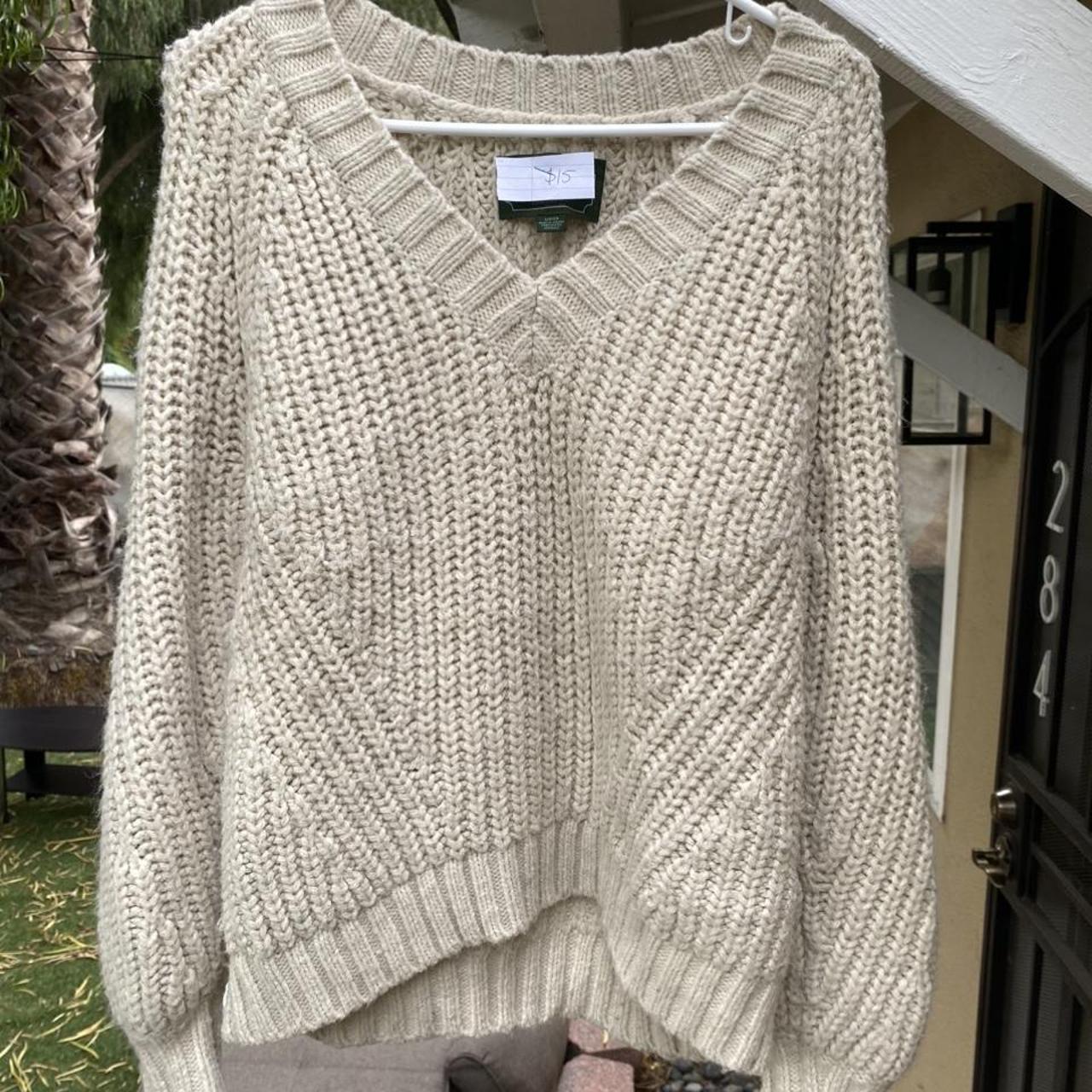 Chunky knit cream sweater with a deep vneck.... Depop