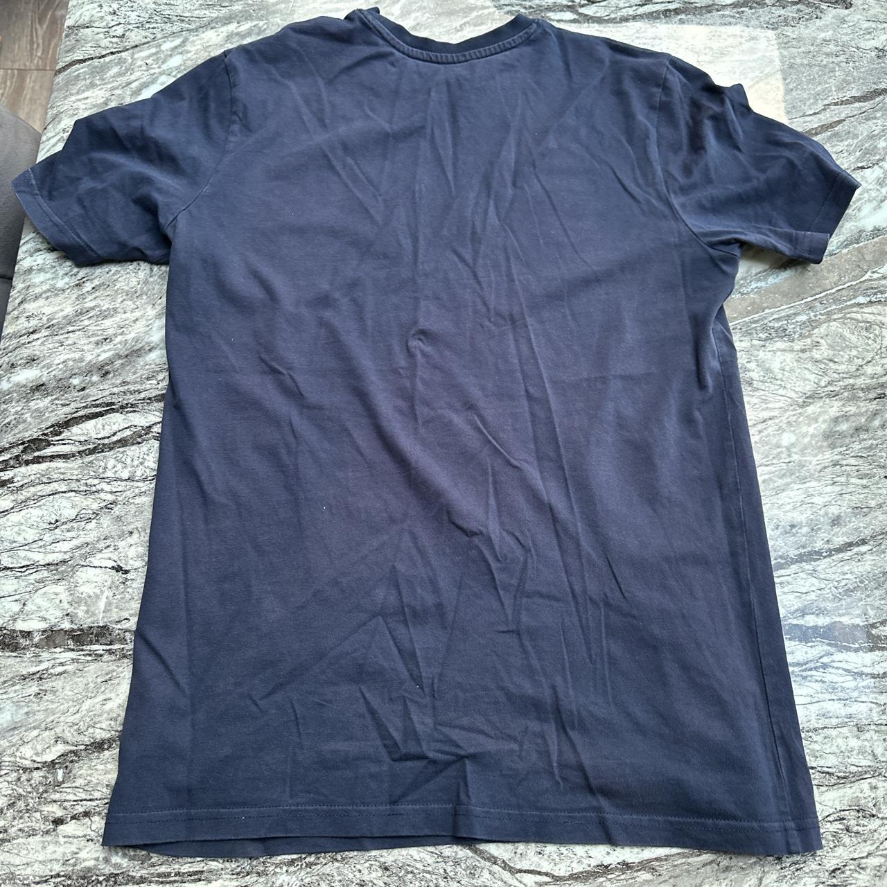 Yelir world navy T-shirt Size medium Worn No rips... - Depop