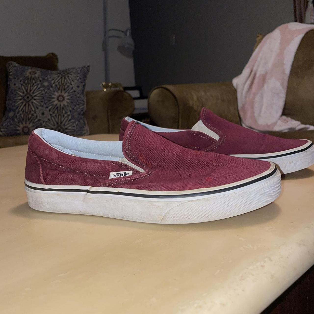 Burgundy Vans slip on sneakers, some