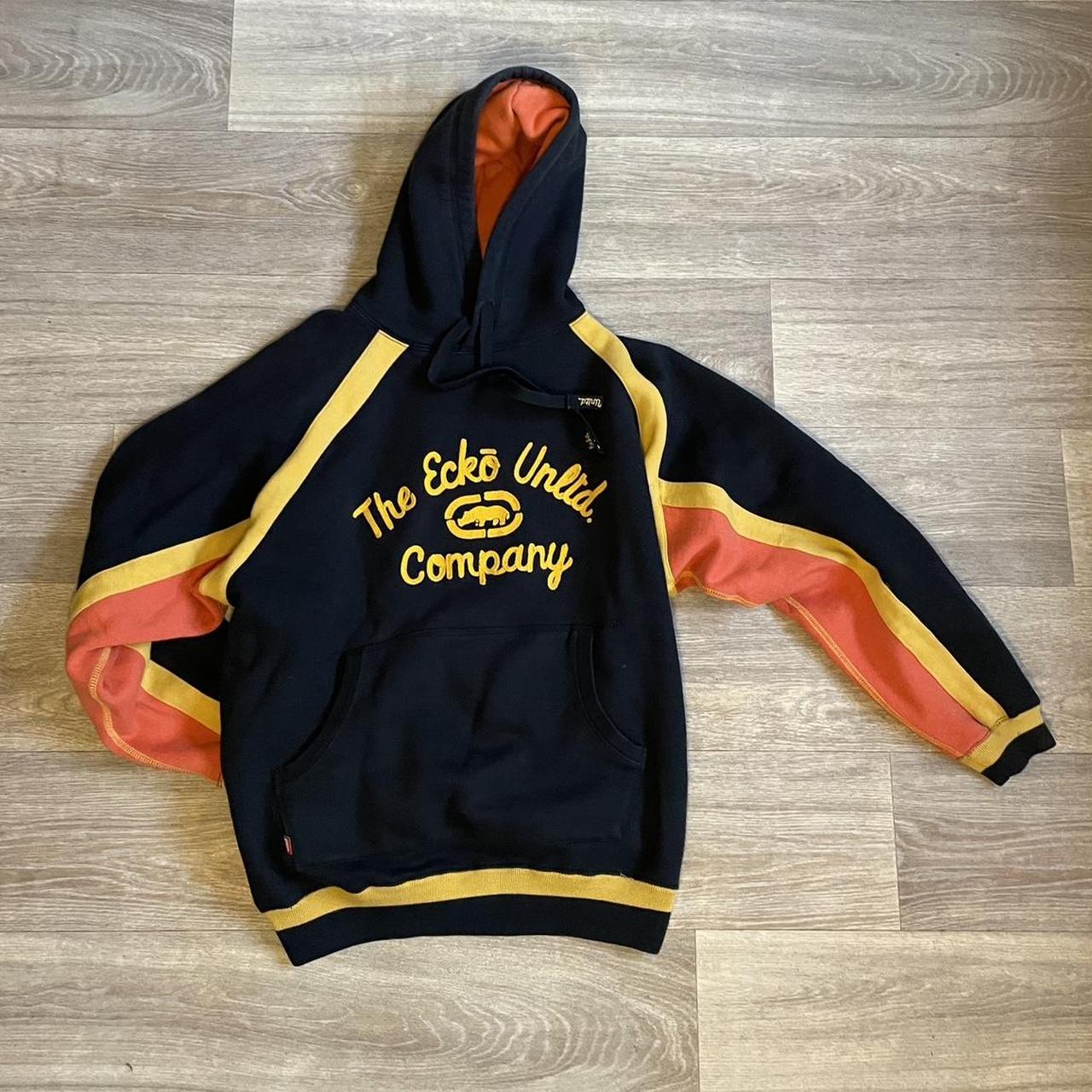 Ecko hoodie, black and orange with spellout on front... - Depop