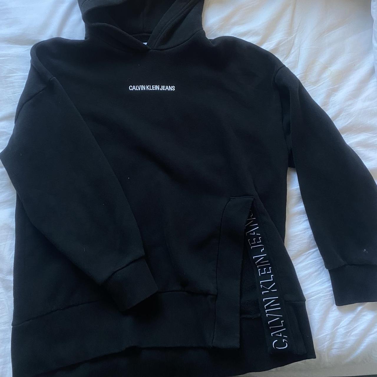 M Calvin Klein black hoodie with slit on left side... - Depop