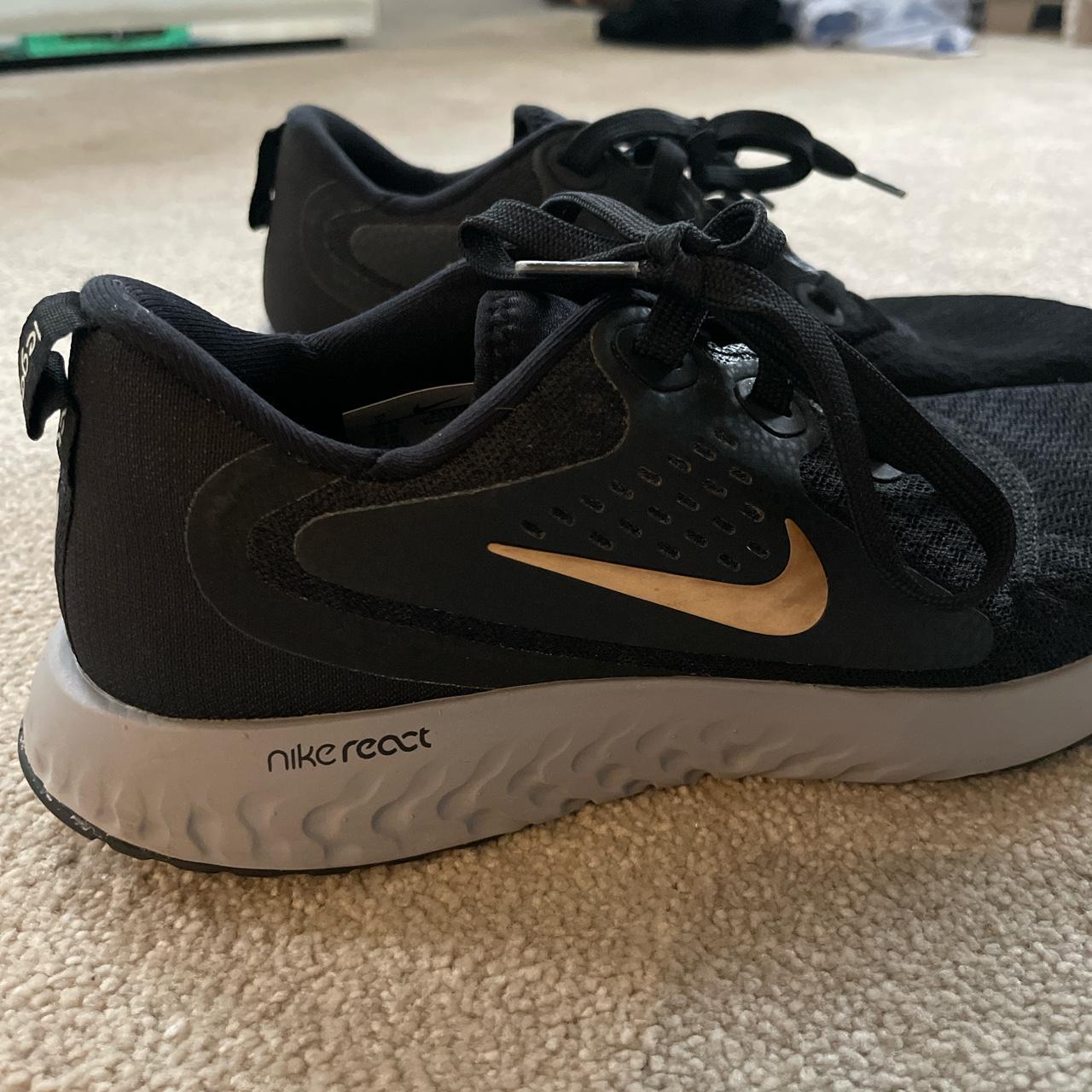 Nike black trainers, gold tick, grey UK size Depop