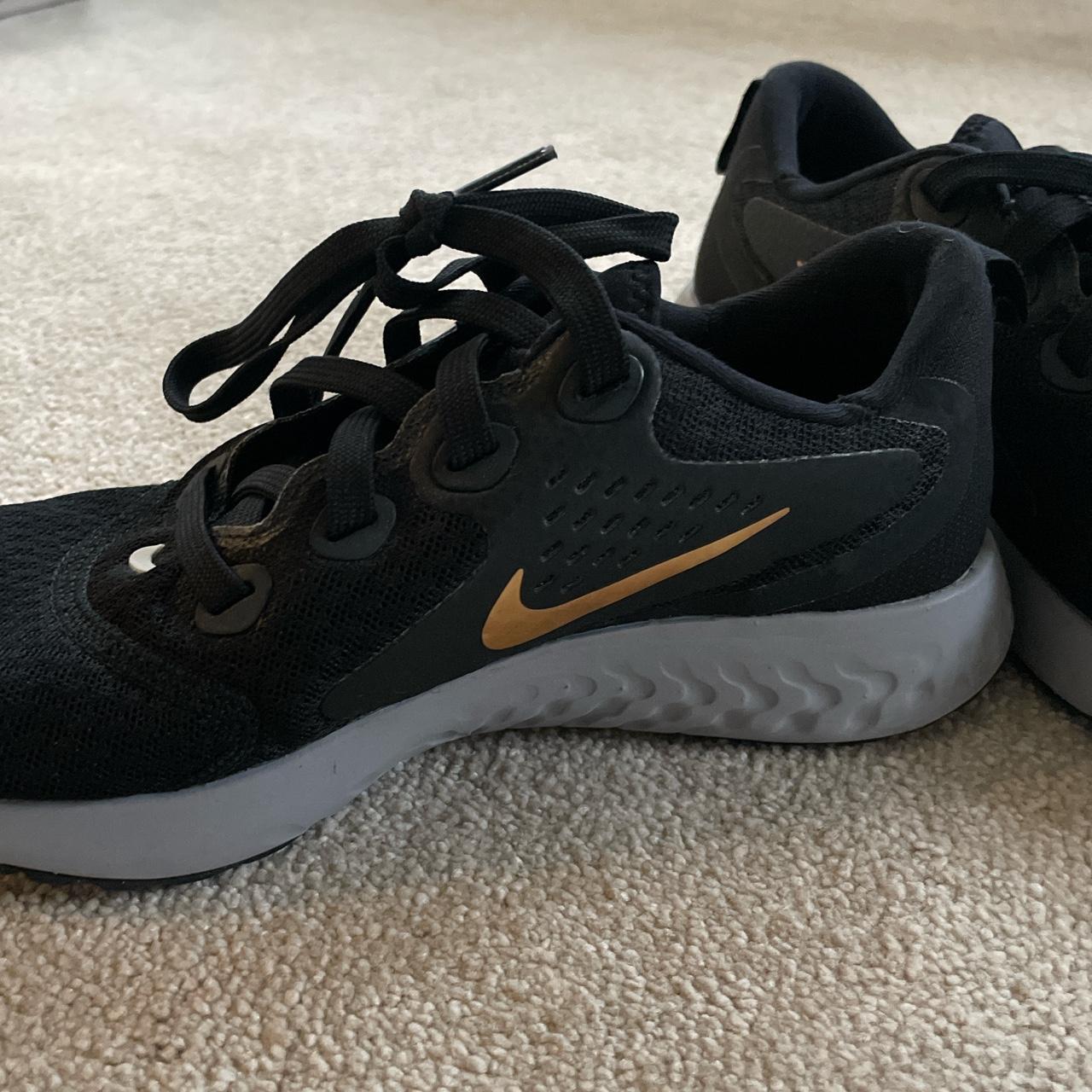 Nike black trainers, gold tick, grey UK size Depop