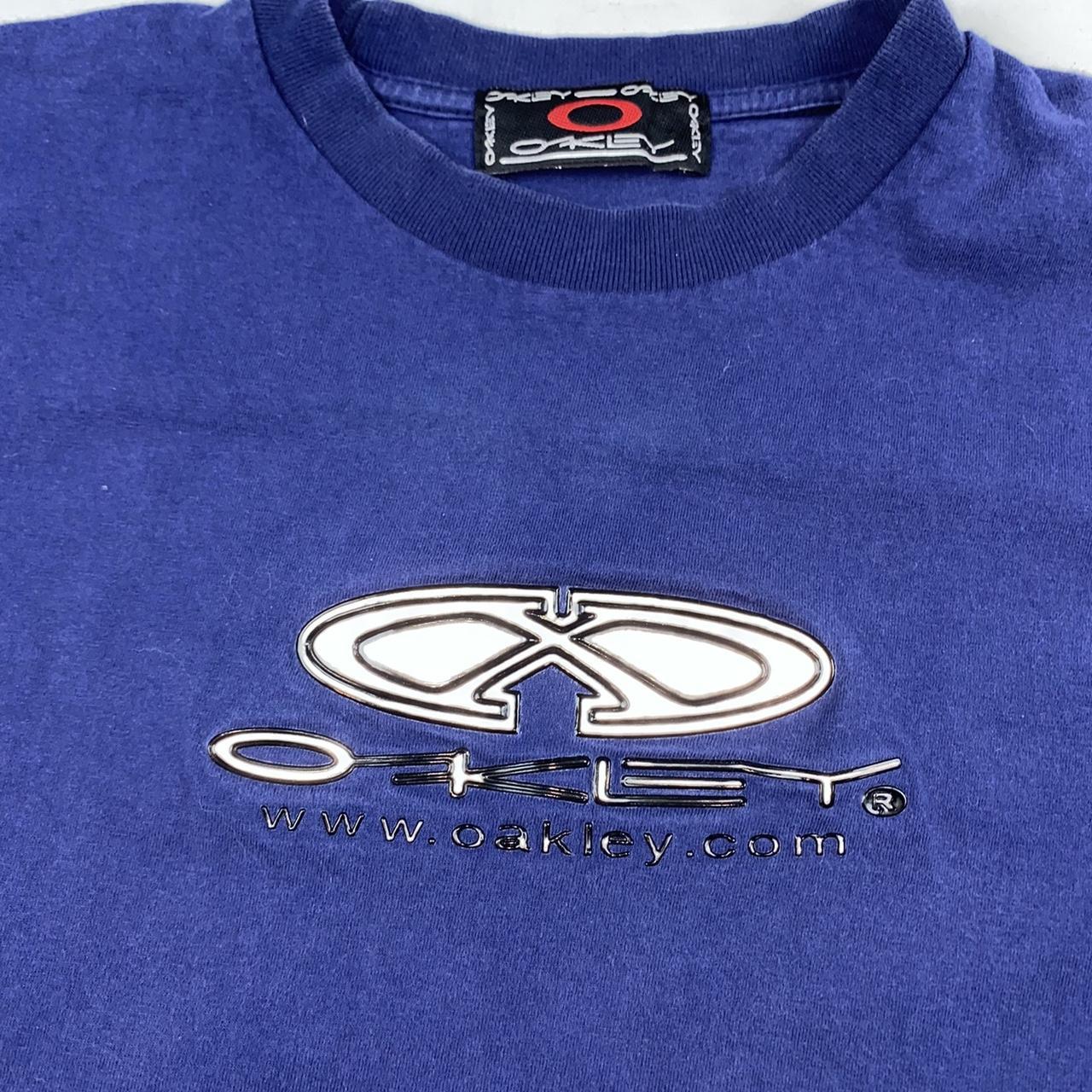 Oakley Women's Navy and Silver Tshirt Depop