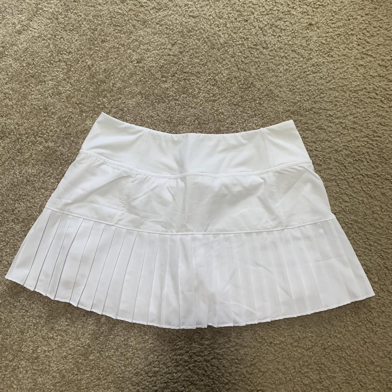 White tennis shirt from Mondetta Has built in Depop