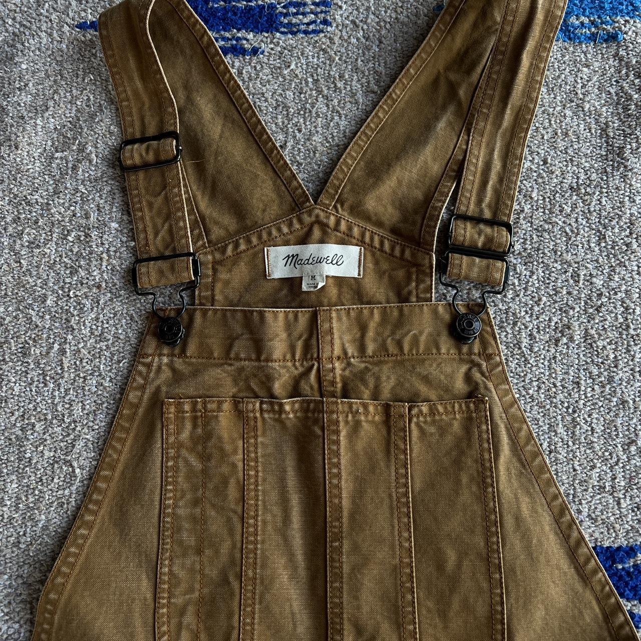 Tan overalls. Light distressed look. Color is... Depop