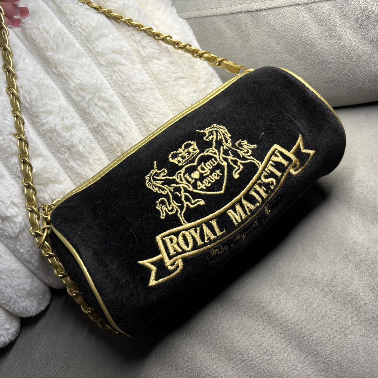 Cute black and gold barrel bag gives juicy couture