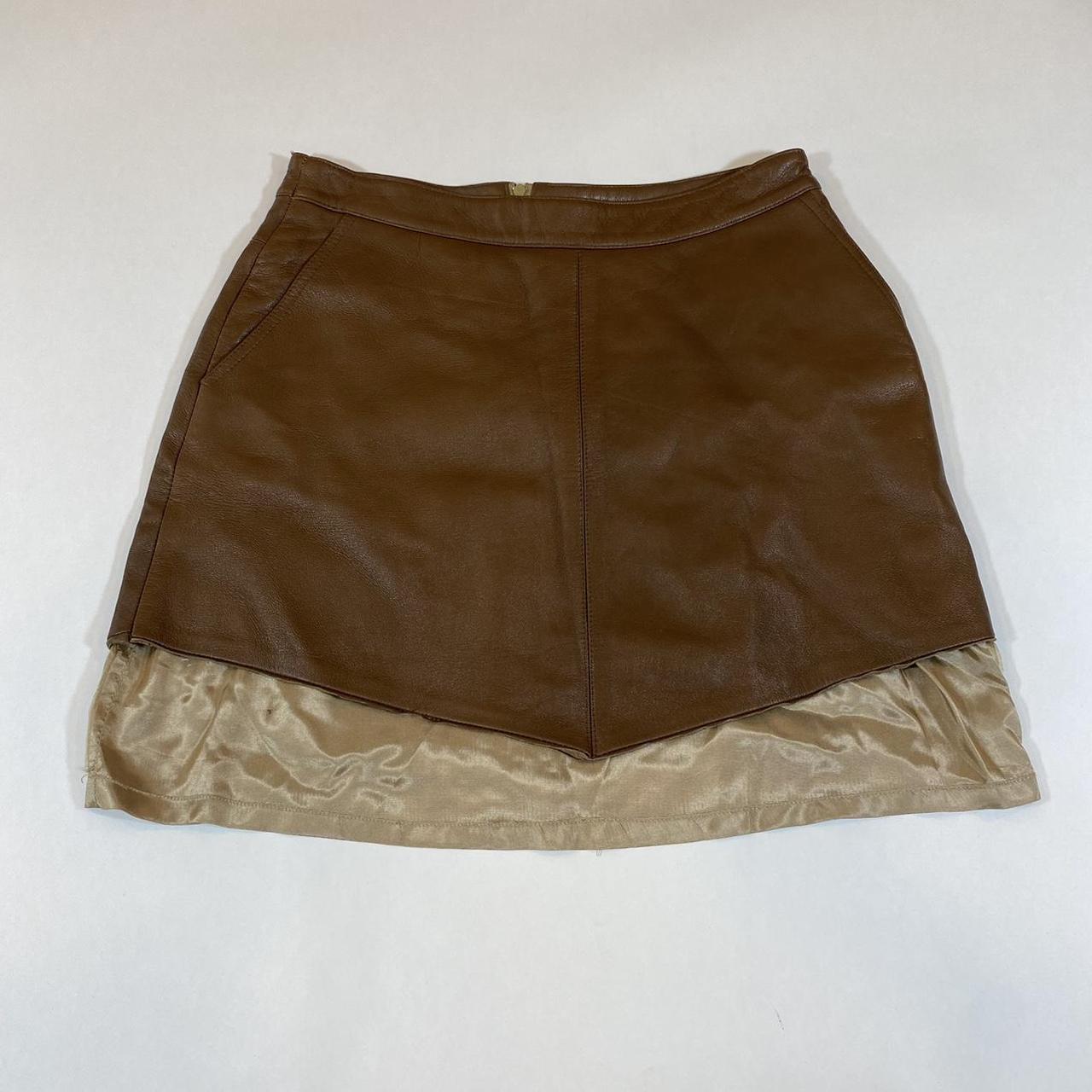 Y2K leather mini skirt. Has silk peeking out the... - Depop