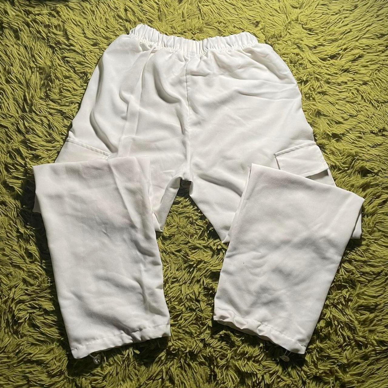 white cargo pants baggy fit and adjustable at the... Depop