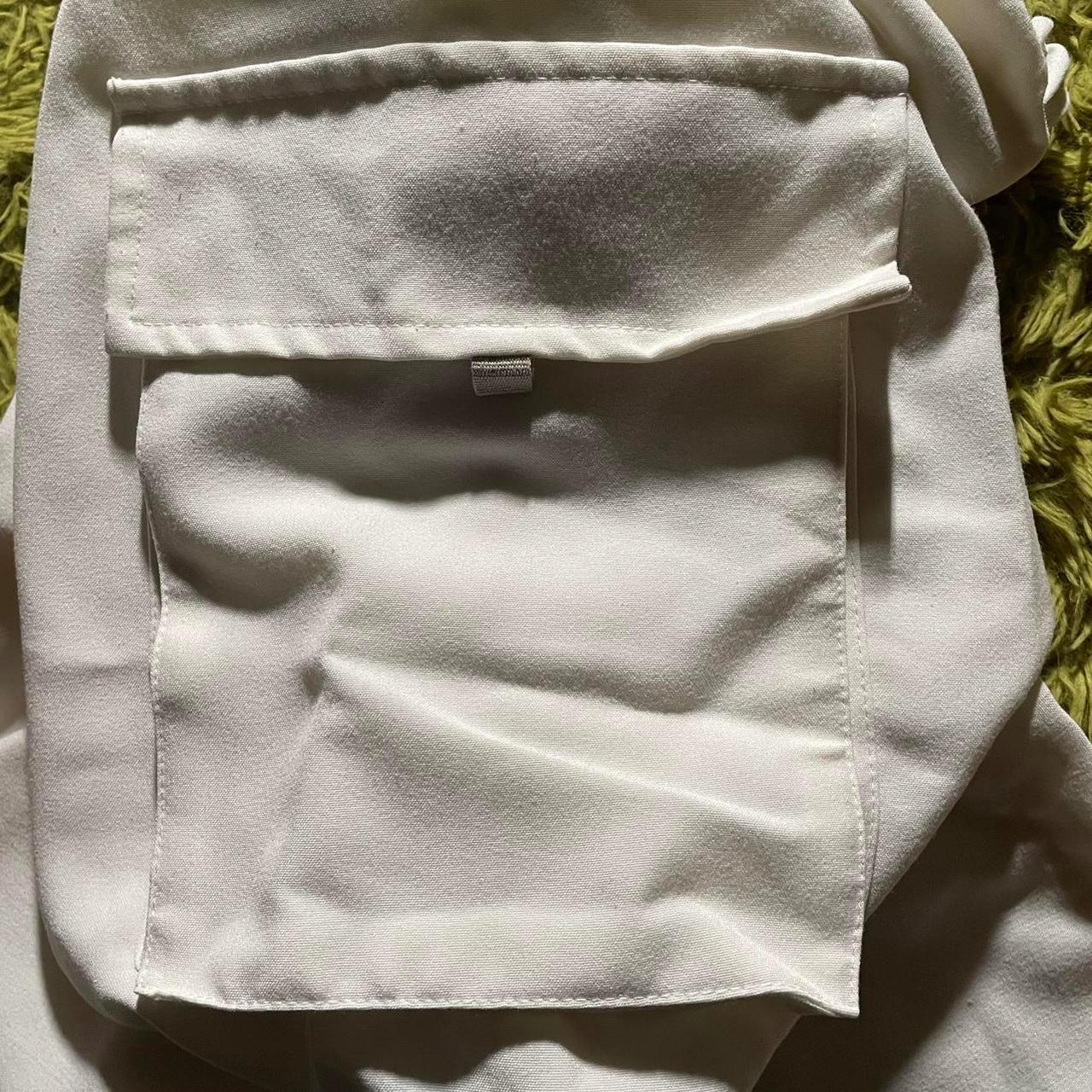 white cargo pants baggy fit and adjustable at the... Depop