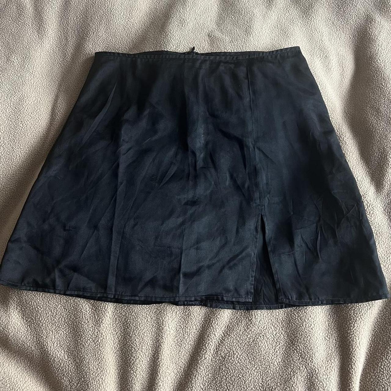 Black silk reformation mini skirt with a little slit... - Depop