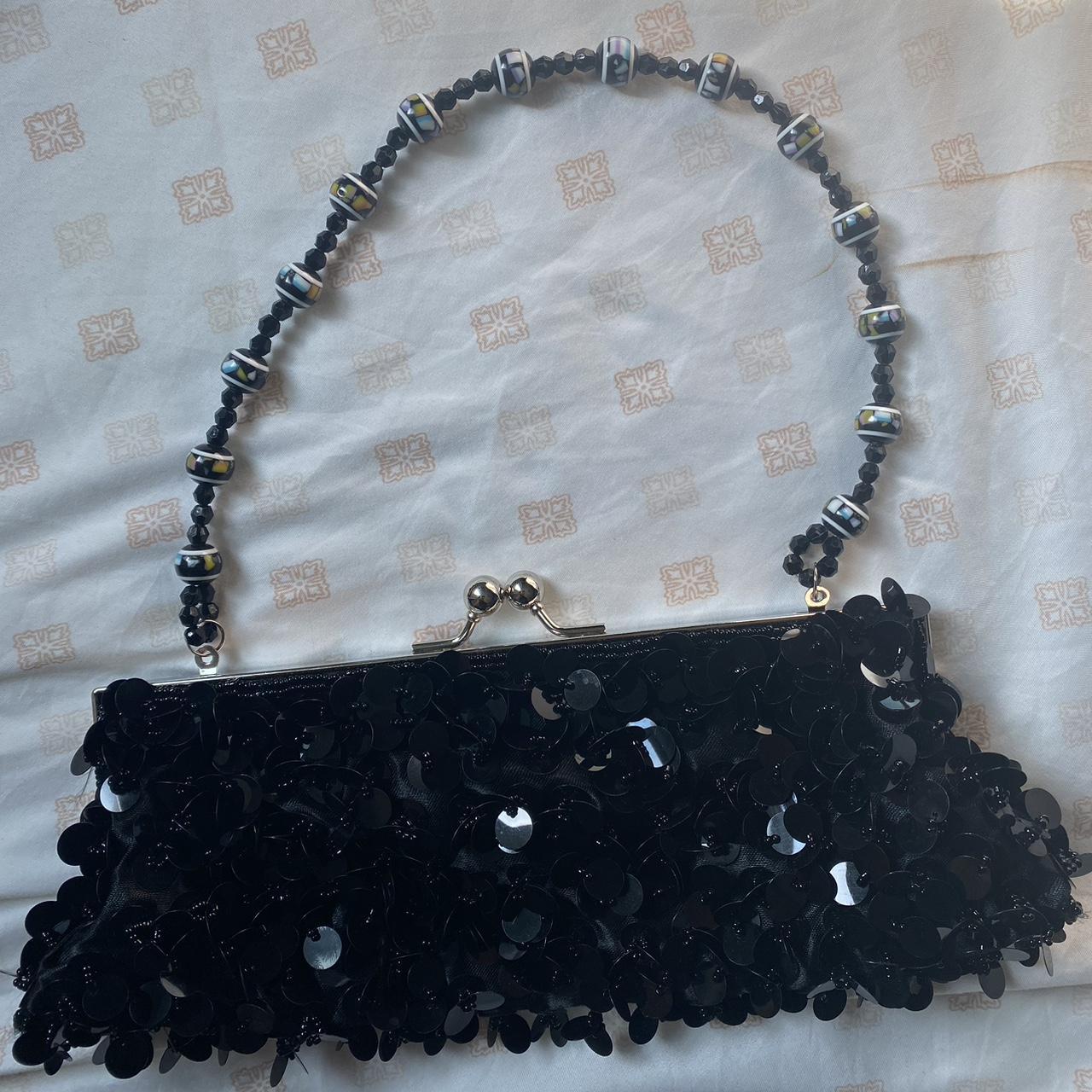 Black textured clutch handbag by “Bijoux Terner”.... - Depop
