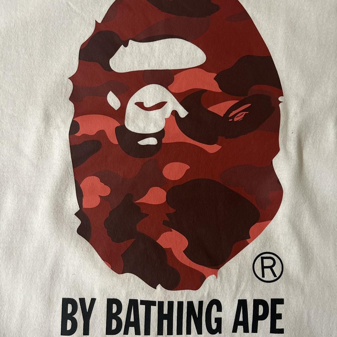 Here we have a: Bape Red Camo Head Tee Condition:... - Depop