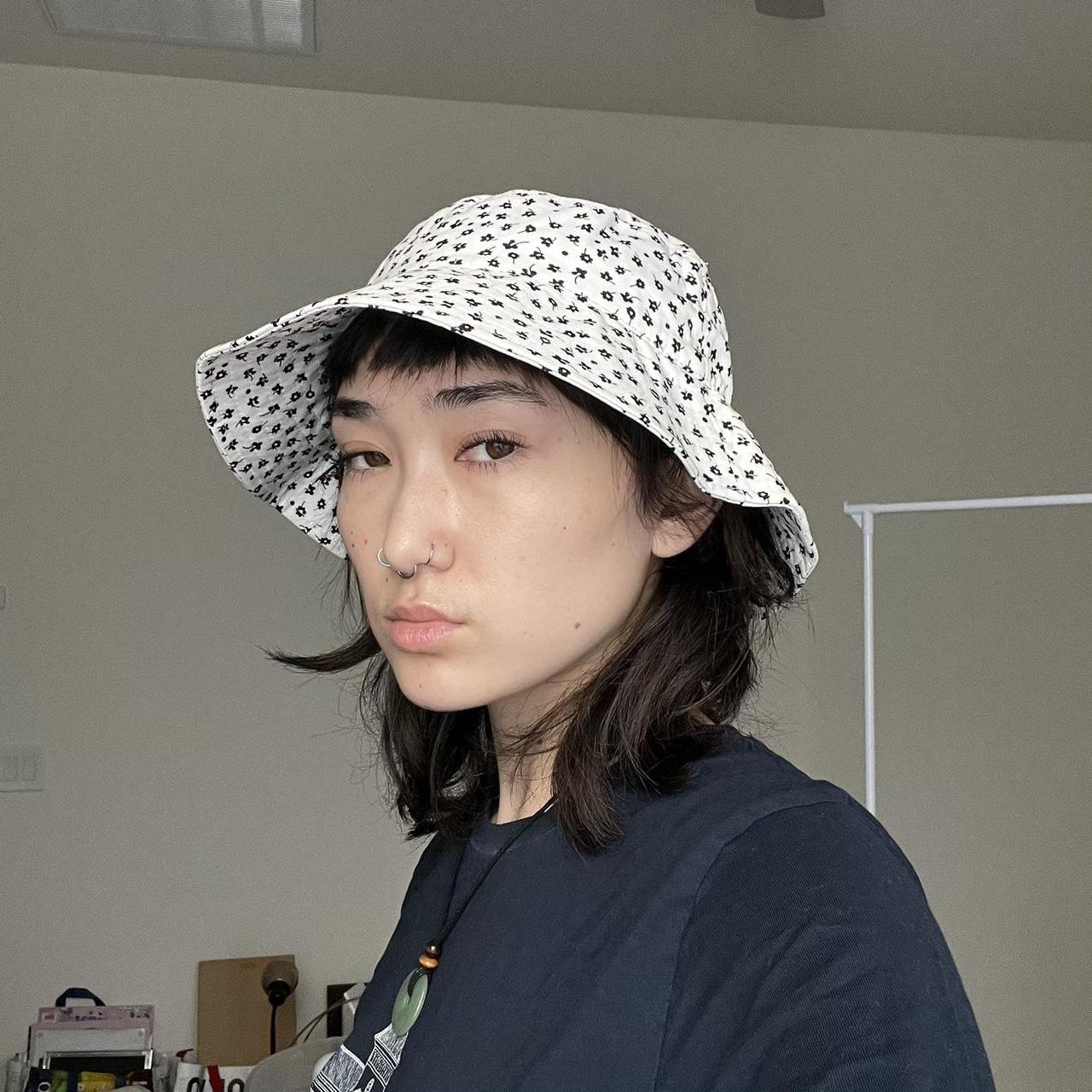 urban outfitters white bucket hat with tiny black... Depop