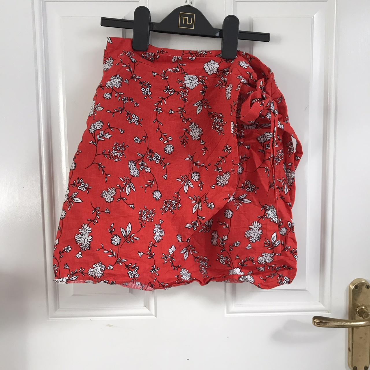Red wrap around mini skirt from Cotton On,... - Depop