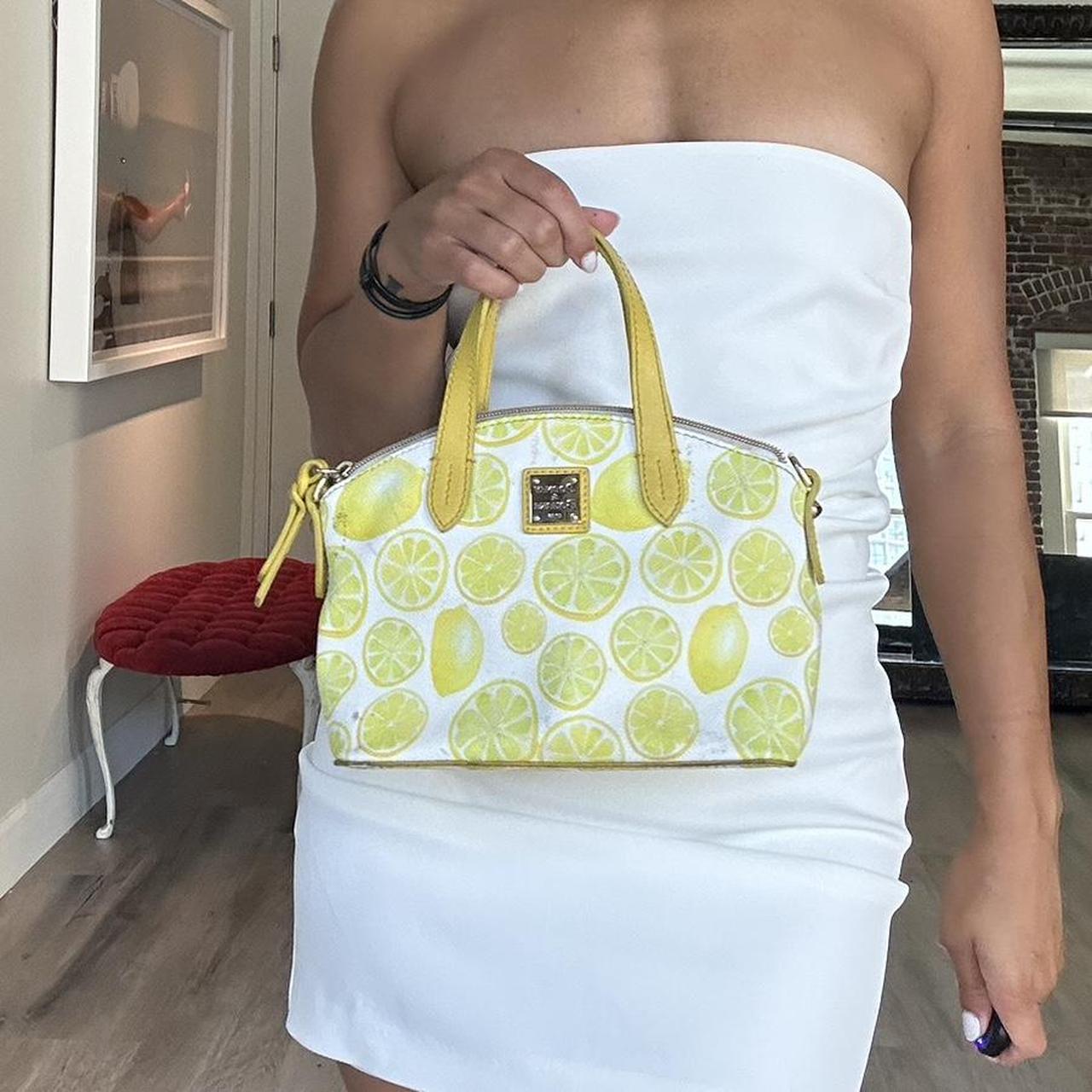 Super cute lemon Dooney and Bourke purse. Very good