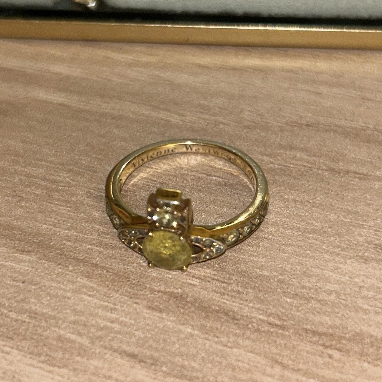 Gold Vivienne westwood ring with green stone some... - Depop