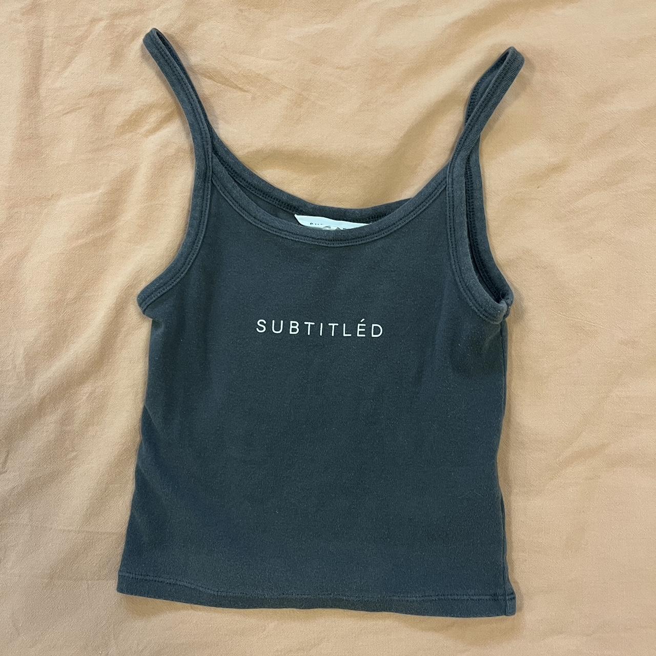 Subtitled top, hemming is coming undone as seen in... - Depop